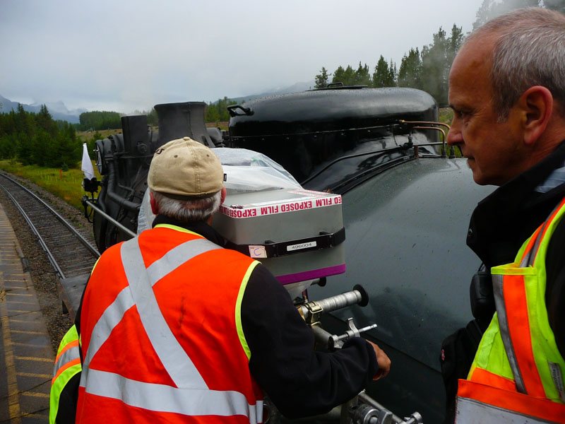 Mark Poirier and crew beside an IMAX rig mounted near a steam locomotive